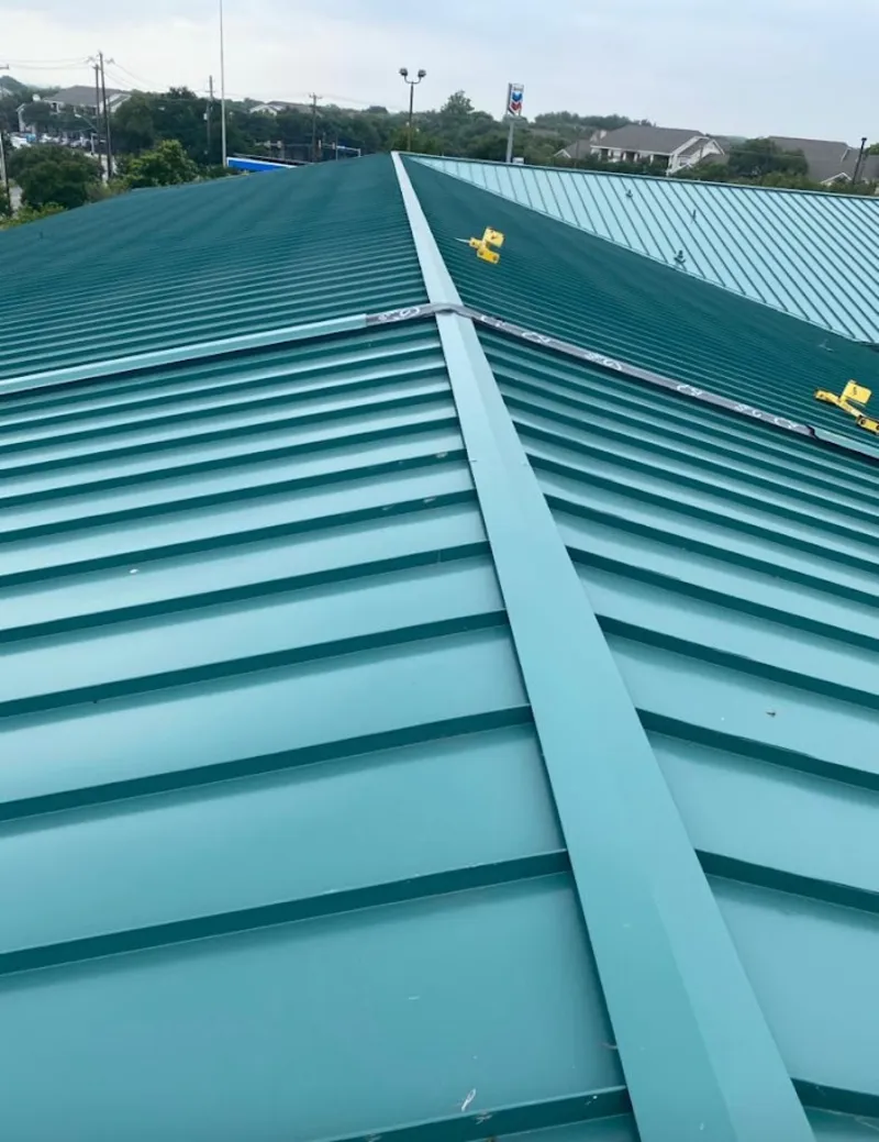 Green commercial metal roof ridge and valley for Metal Roof Repair in Riverton